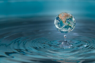 World dropping in a water drop ,concept for water pullation and conservative.Elements of this image...