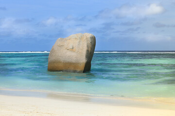 Rock like a sail in a vibrant blue ocean.