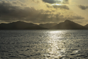 Fototapeta na wymiar Ocean lagoon in a sunset over the mountains.