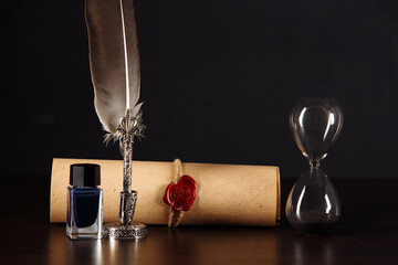 Hourglass and testament and last will. Notary public tools close-up.