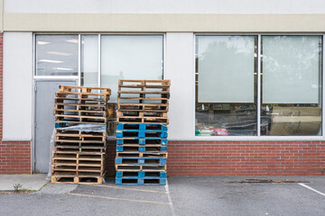 not having business insurance, many supermarket owners are using wood meant to board up shops as...