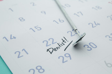 Dental health and teethcare concept. Dentist appointment in calendar and professional dental tools