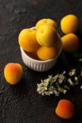 selective focus: ripe fresh apricots in a clay bowl