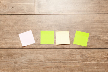Colored stickers note isolated on wood  background