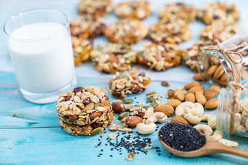 Multigrain Cookies and vegetarian ingredient with milk on blue wooden table