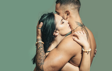 Couple in love. Beautiful couple embracing each other. Young lovers. Portrait of sexy beautiful couple. Sensual young people in love. Half naked young couple is making love, tender and romantic.