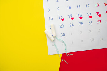 Menstruation calendar with cotton tampons.Woman critical days, woman hygiene protection concept.