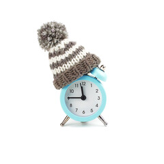 Alarm clock in a knitted hat