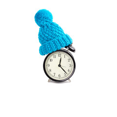 Alarm clock in a knitted hat