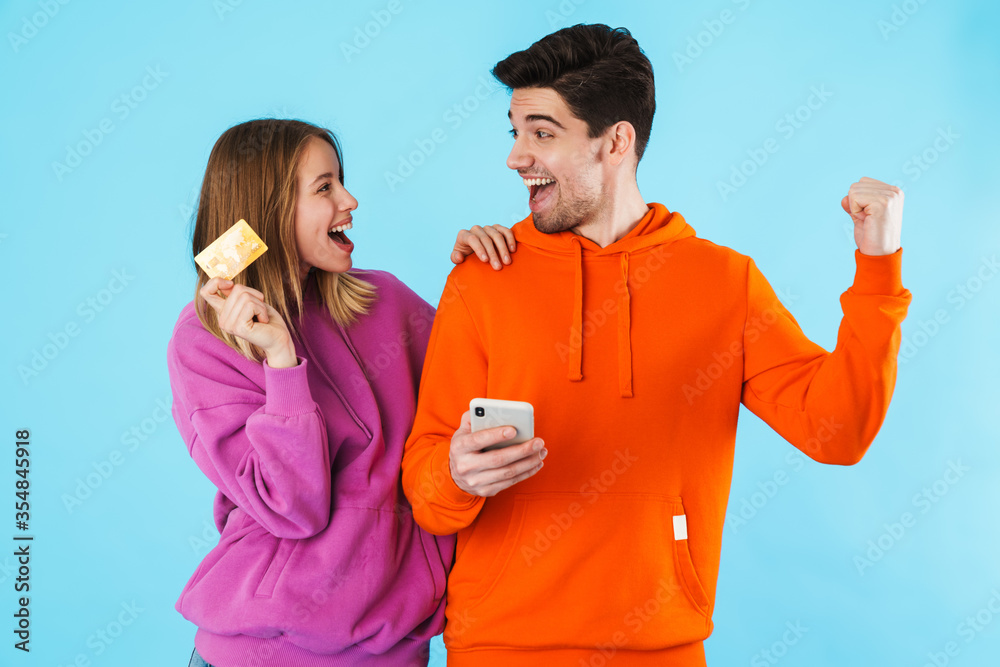 Poster portrait of a young couple wearing hoodies