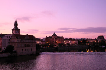 Vltava embankment at sunrise. Old Prague architecture at dusk.
