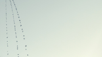 Three jets of water on the background. Motion blur. Copy space.