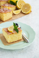 Sweet lemon cake on plate. Summer light dessert. Close up