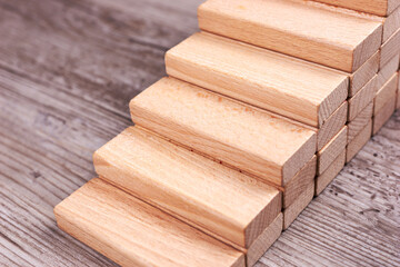 Wooden toy blocks as stairs. Business development and growth concept