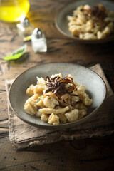 Traditional German noodles with cheese and fried onion
