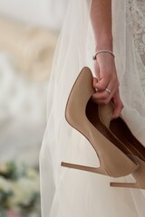 Fototapeta na wymiar bride hand with shoes