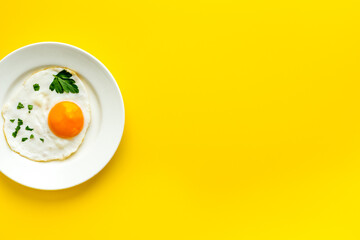 Fried eggs on plate - yellow desk top view space for text