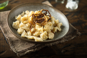Traditional German noodles with cheese and fried onion