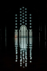 Obraz premium the daily life of different people at the Hassan II Mosque in Casablanca, the pray, talk, and spent time together on a normal summer day. The mosque has unique and Arabic doors and towers 