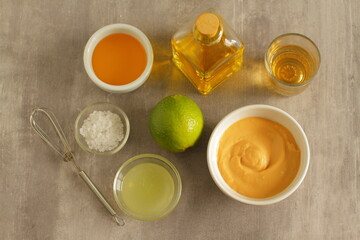 Ingredients for salad dressing with lemon juice, honey and mustard