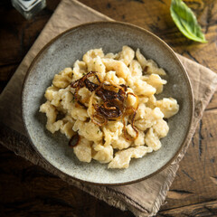 Traditional German noodles with cheese and fried onion