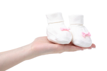 White socks baby's bootees for newborn child baby in hand on white baclground isolation