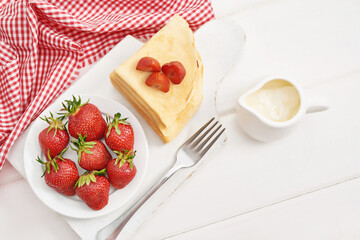 Strawberries and pancakes. Pancakes with strawberries. Romantic breakfast. Valentine's Day. Greeting Card Mother's Day. Breakfast in hotel room. Maslenitsa. Pancake week. Women's Day Congratulation