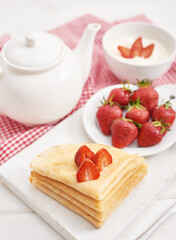 Strawberries and pancakes. Pancakes with strawberries. Romantic breakfast. Valentine's Day. Greeting Card Mother's Day. Breakfast in hotel room. Maslenitsa. Pancake week. Women's Day Congratulation