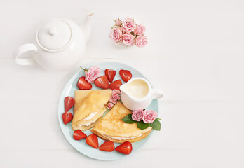 Strawberries and pancakes. Pancakes with strawberries. Romantic breakfast. Valentine's Day. Greeting Card Mother's Day. Breakfast in hotel room. Maslenitsa. Pancake week. Women's Day Congratulation