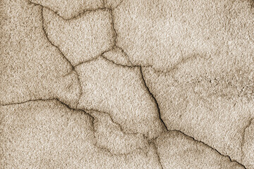 Abstract sepia old covered with cracks and scratches the wall of the building. For creative unusual vintage design