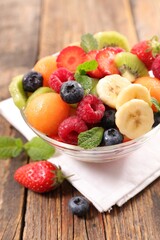 mixed fruit salad with melon, strawberry, blueberry, kiwi