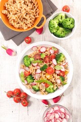 pasta salad with broccoli, radish and tomato