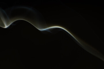 Smoke scented candles on a black background