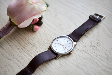 Men's classic watch (clock) on the table.