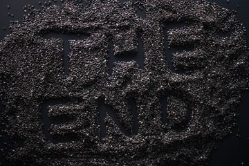 Words 'THE END' written with chia seeds on gray background, top view, copy space.