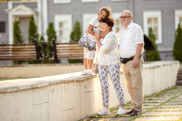 Grandparents playing with their granddaughter