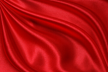 Obraz premium Red cloth waves background texture.