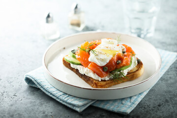 Poached egg with salmon and avocado on toast