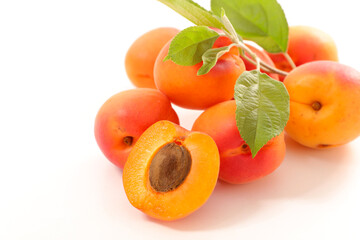 fresh apricot and leaf on white background