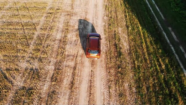 Aerial rear view of a orange car. 4k