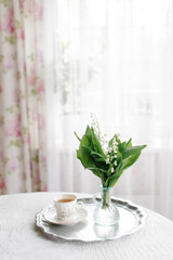 lilies of the valley in white room