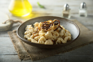 Traditional German noodles with cheese and fried onion