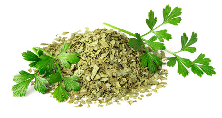 heap of dried parsley flakes and fresh parsley leaves isolated on white background