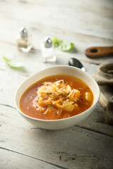 Traditional homemade sauerkraut soup in a white bowl
