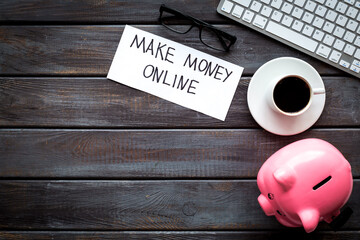 E-commerce online concept with piggy bank on office workplace. Top view