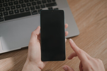 woman using smartphone in the office