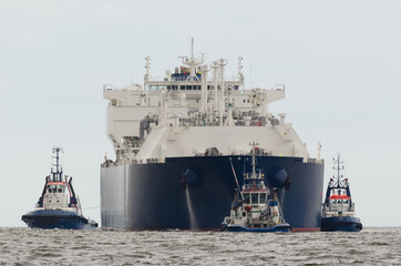 LNG TANKER - Merchant vessel flows with a load of fuel to the port in tug insurance