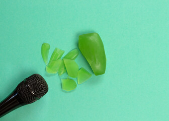 ASMR concept. Specific auditory irritants. Soap and a knife lie in front of the microphone. Top view, flat lay.