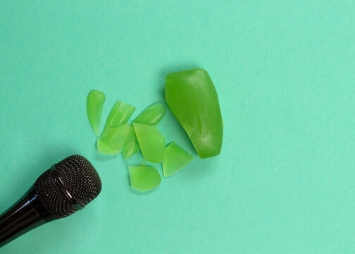 ASMR concept. Specific auditory irritants. Soap and a knife lie in front of the microphone. Top view, flat lay.