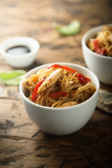 Fried rice noodles with chicken and pepper